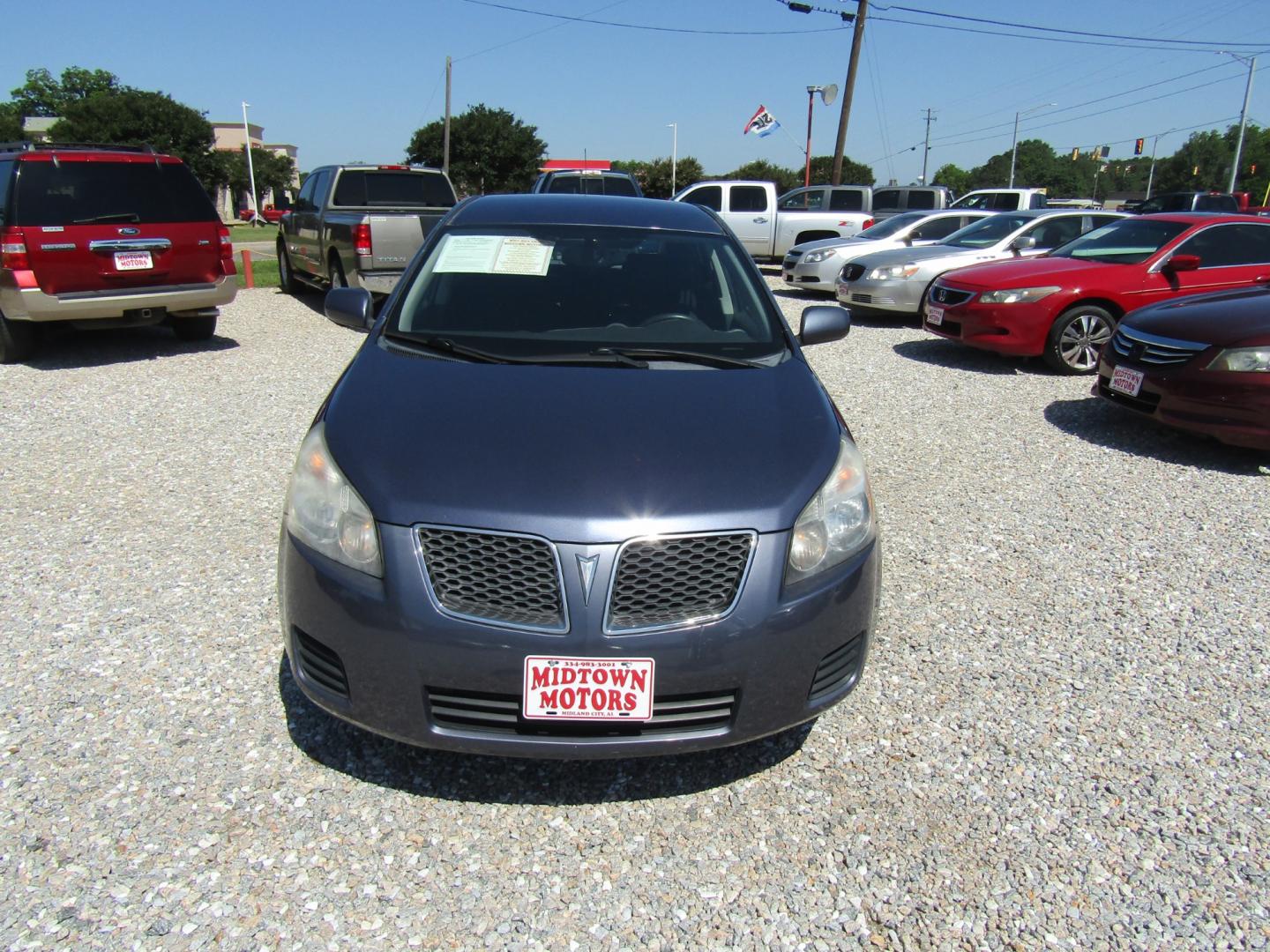 2009 Blue /Gray Pontiac Vibe 1.8L (5Y2SP67819Z) with an 1.8L L4 DOHC 16V engine, 4-Speed Automatic Overdrive transmission, located at 15016 S Hwy 231, Midland City, AL, 36350, (334) 983-3001, 31.306210, -85.495277 - Photo#1